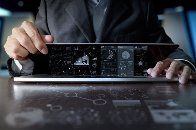 business man hand working on laptop computer with digital layer business strategy and social media diagram on wooden desk.jpeg